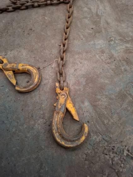 Chain sling hooks laid out for examination